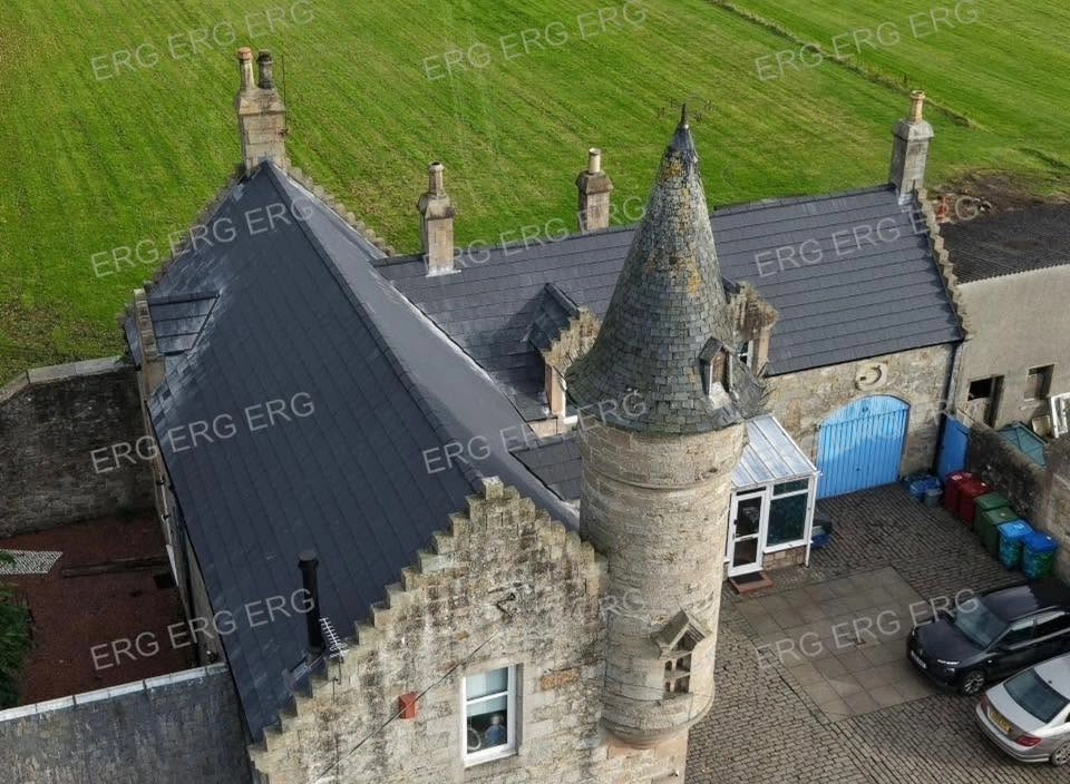 Professional roofing installation on a traditional home