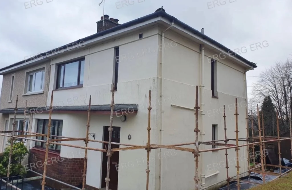 Property exterior showing cracked and ageing render before roughcasting works
