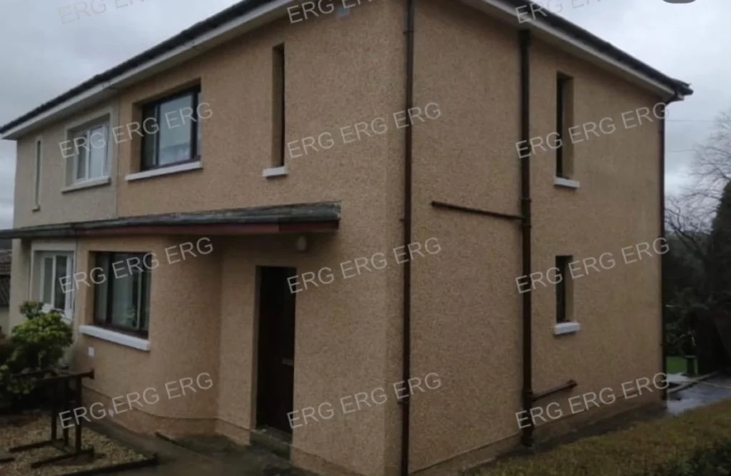 Residential property with new roughcasting and pebble dash finish